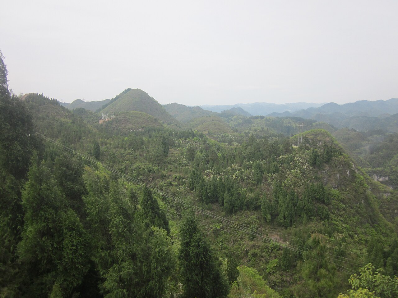Qinglong Cave's temple complex clinging to the cliff face
